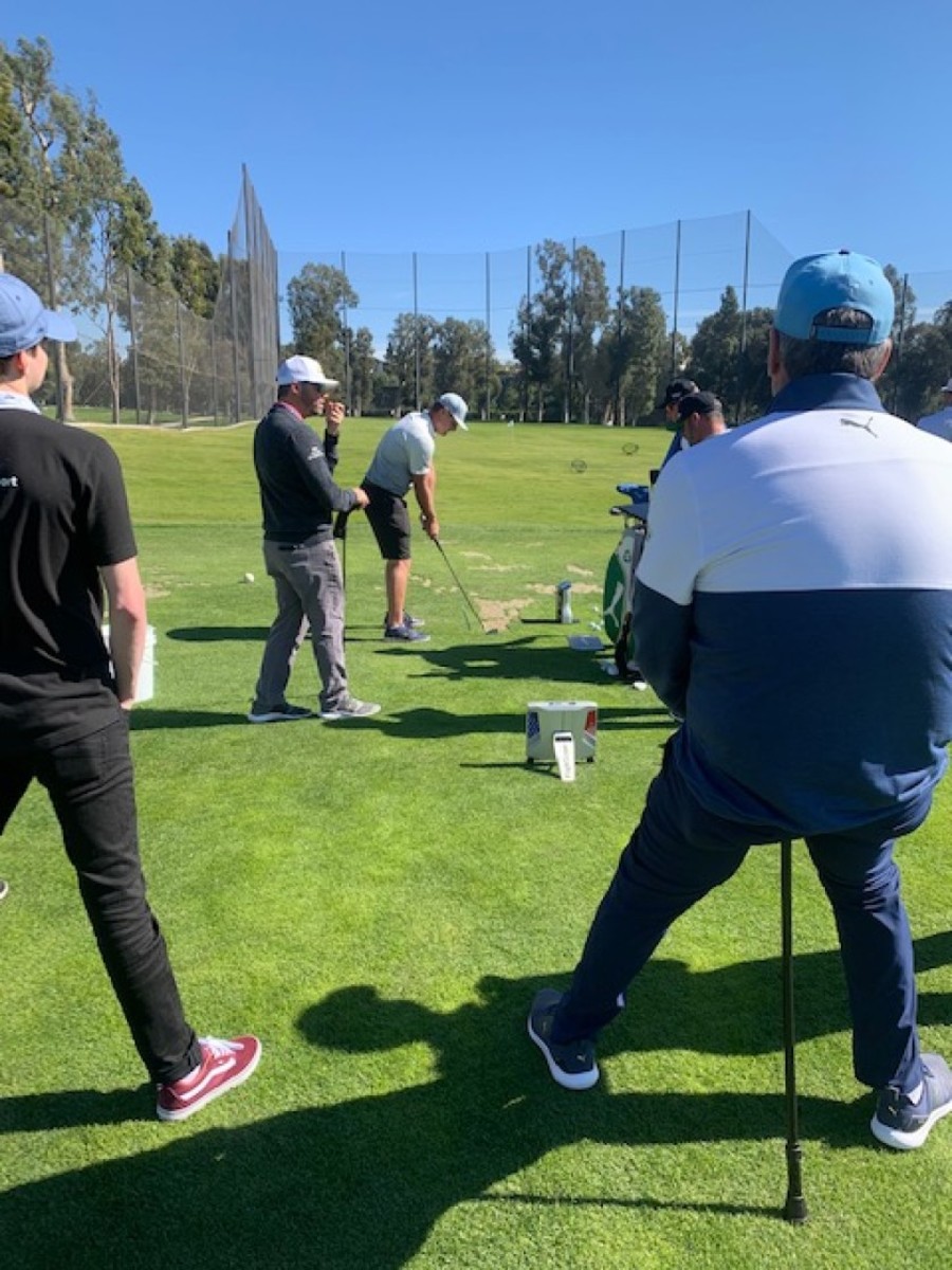 Bryson DeChambeau attracts a crowd during a range session last week before the Genesis Invitational at Riviera Country Club in Pacific Palisades, Calif. Not only did DeChambeau have plenty of eyes from his team, but he also used an extra launch monitor. 